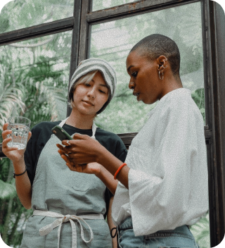 Two friends looking at a phone together