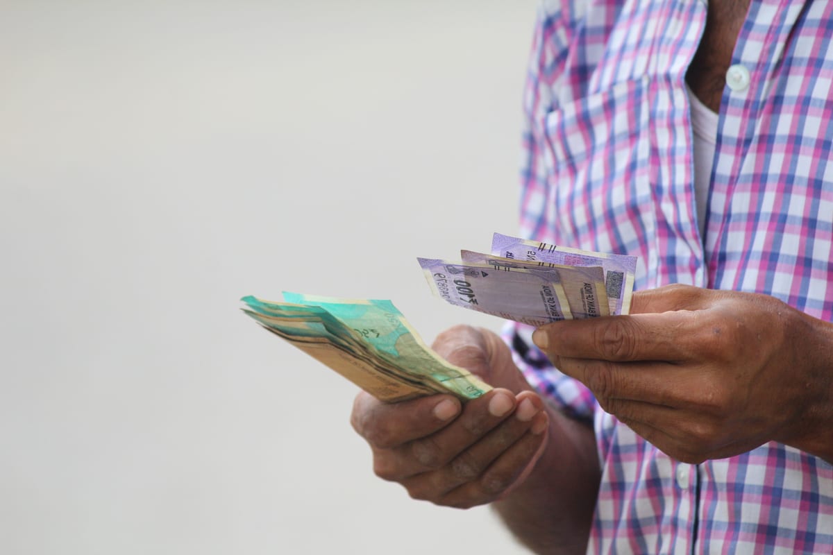 A trader counting banknotes