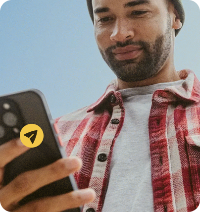 Man smiling at his phone